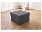 Matelas pliant gris sur un parquet clair