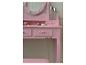 Coiffeuse rose avec miroir et articles de maquillage
