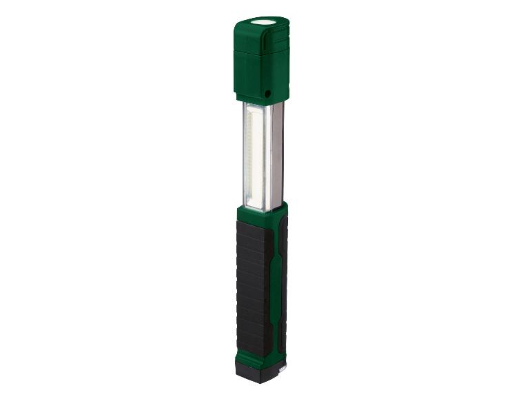 Une lampe de travail LED verte avec une poignée noire.