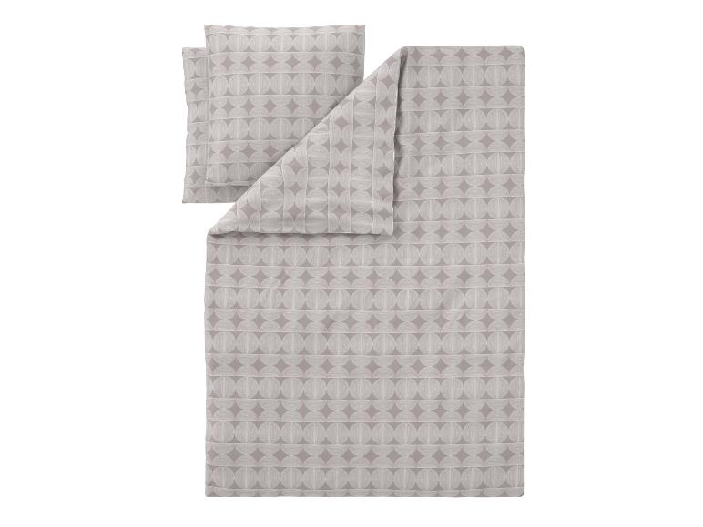 Parure de lit grise avec motif géométrique.