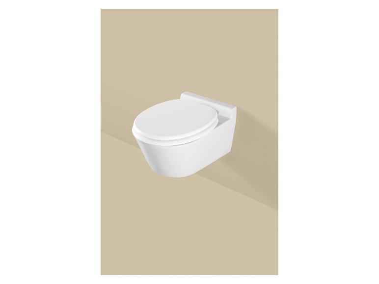 Toilettes suspendues blanches avec abattant sur fond beige.