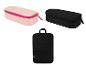 Trousses de maquillage ou de voyage rose clair et noires, et une housse noire pour ordinateur portable.