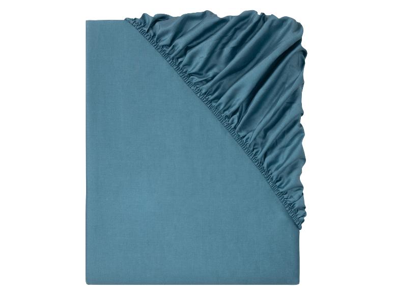 Drap-housse bleu sarcelle, tissu doux.