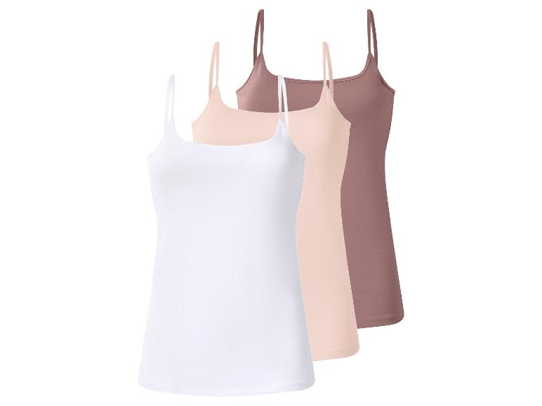 Trois débardeurs pour femmes en blanc, beige et marron.