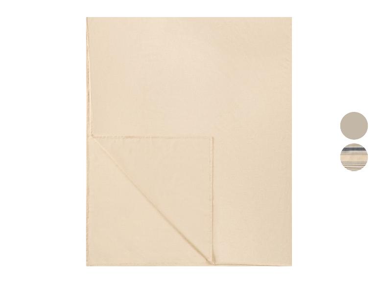 Couverture beige au design uni et option rayée bleue.