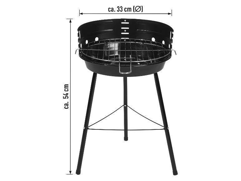 Barbecue noir sur pied avec grille de cuisson.