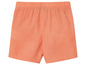Un short orange pour bébé.