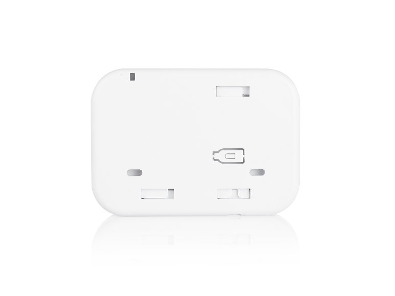 Arrière d'un appareil électronique carré blanc avec fentes et trous.