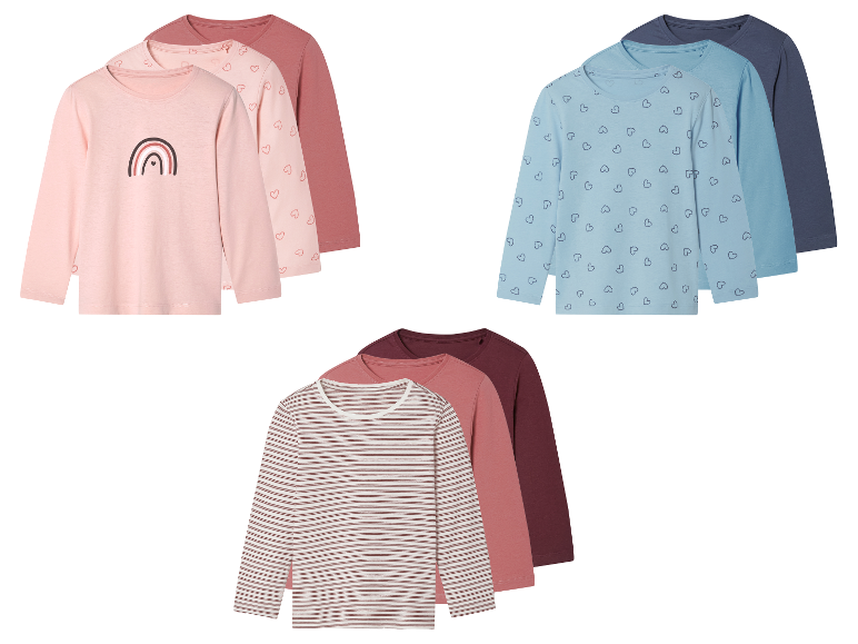 Trois ensembles de t-shirts à manches longues pour enfants avec différents motifs : arc-en-ciel, cœurs et rayures.
