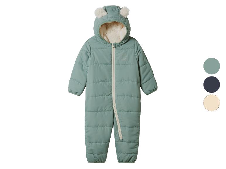 Combinaison de neige vert menthe pour bébé avec oreilles d'ours et motif raton laveur.