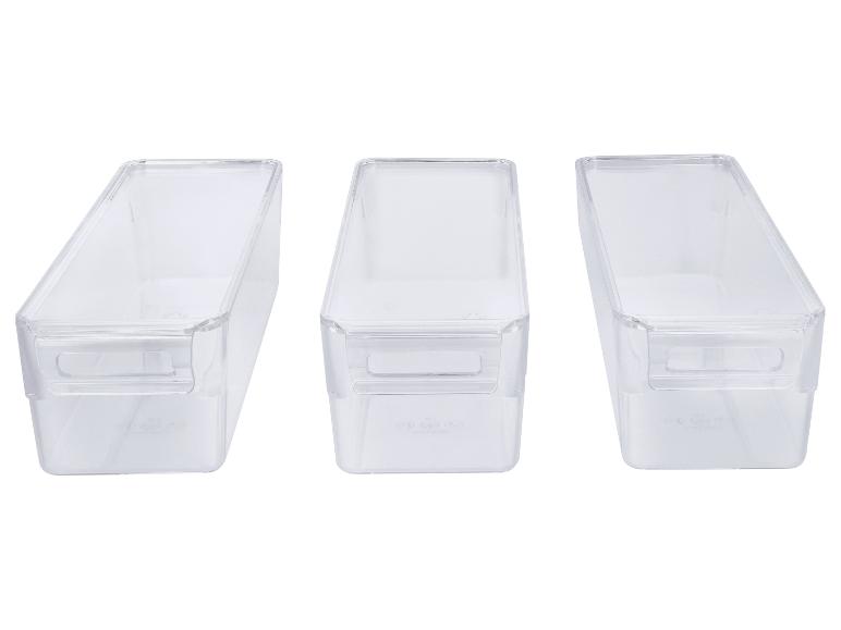 Trois bacs de rangement transparents avec poignées, vus de dessus