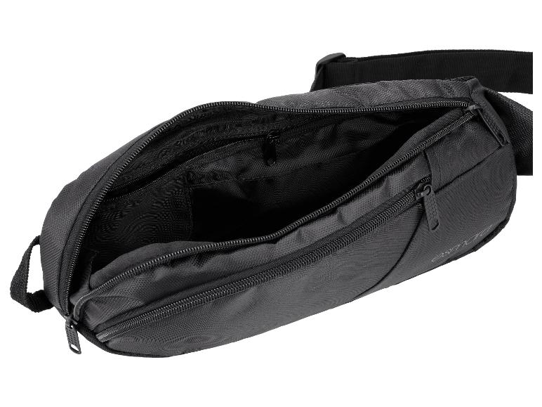 Sac banane noir ouvert avec plusieurs compartiments et fermetures éclair.