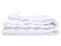 Couette blanche pliée avec motif matelassé