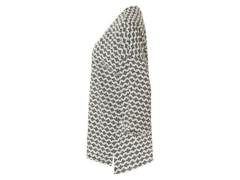 Une robe blanche à imprimé floral foncé de profil.