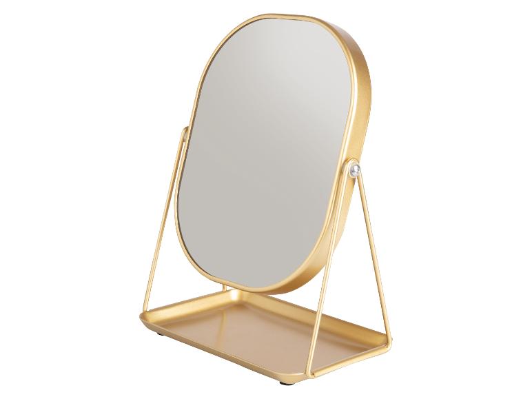 Miroir de table ovale doré avec support et plateau.