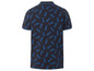 Un polo bleu marine avec un motif d'ananas.