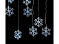 Flocons de neige lumineux sur fond noir.