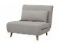 Fauteuil convertible gris clair avec coussin.
