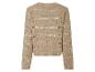 Pull en maille beige à motif ajouré.