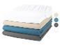 Draps-housses empilés : blanc, beige, bleu sarcelle et gris.
