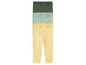 Trois paires de leggings en jaune, vert et vert foncé.