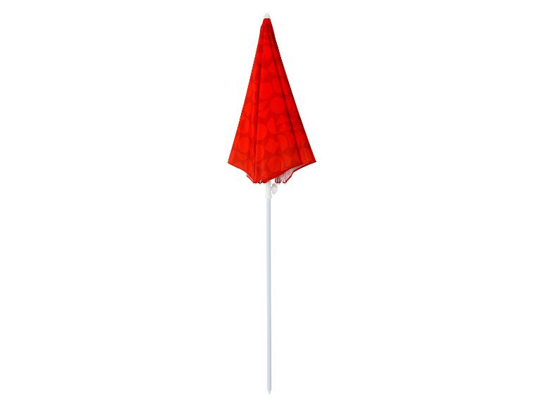 Parasol rouge avec mât blanc et motif géométrique.
