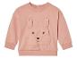 Un sweat-shirt bébé rose à manches longues avec un lapin