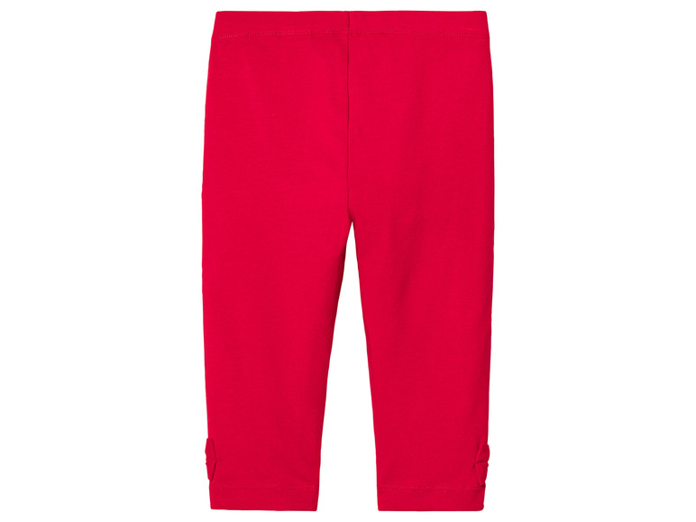 Leggings rouges avec des nœuds en bas.
