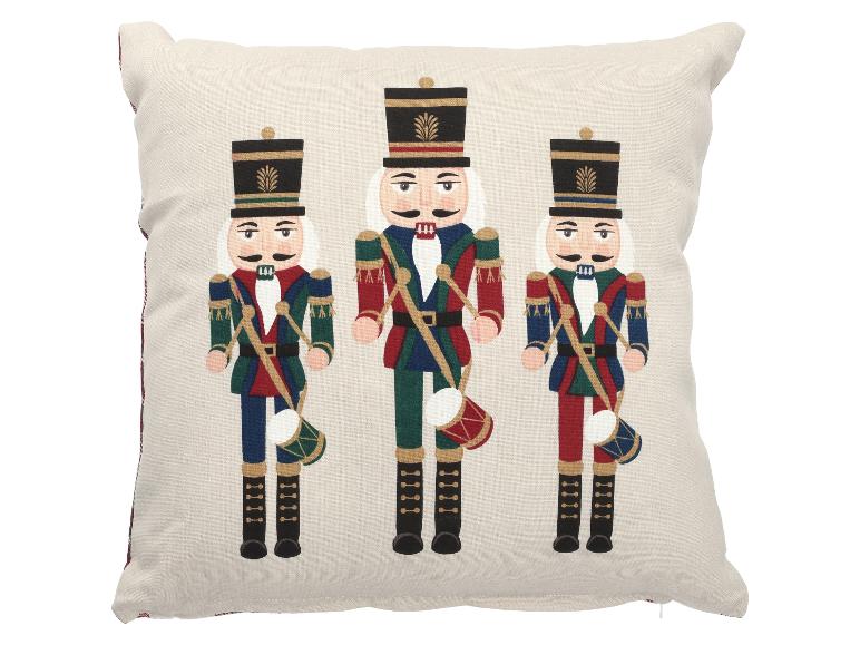 Coussin décoratif avec trois casse-noisettes en uniformes colorés.
