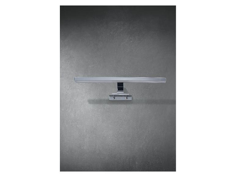 Lampe murale LED horizontale sur un mur gris.