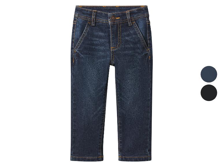 Pantalon en jean bleu foncé pour enfants avec détails de surpiqûres.
