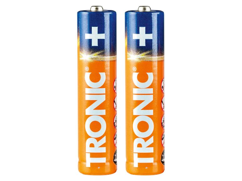 Deux piles alcalines AA orange et bleues avec un signe plus blanc.