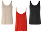 Des débardeurs en lin beige, rouge et noir.