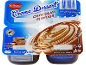 Dessert lacté au chocolat, en pack de quatre, avec informations nutritionnelles.