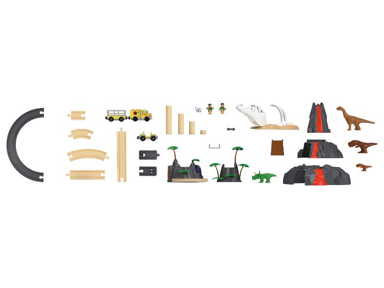 Ensemble de jeu sur le thème des dinosaures avec rails de train, véhicules et figurines.