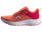 Chaussures de sport pour femmes dans les tons orange et rouge avec des détails vert lime