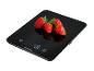 Balance de cuisine noire avec quatre fraises, affichant 40 g.