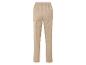 Pantalon beige avec ceinture élastique.