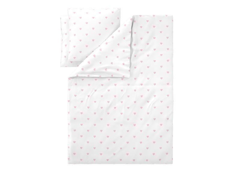 Parure de lit blanche avec des cœurs roses