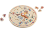 Horloge d'apprentissage en bois avec animaux et pièces de puzzle numérotées.