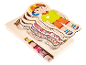 Puzzle en bois multicouche montrant le squelette, les muscles et les organes d'un enfant.