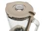 Un blender beige avec un pot en verre et un couvercle.