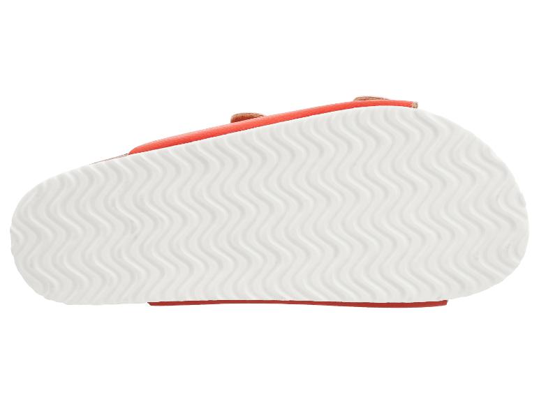 Semelle de sandale avec un motif ondulé en blanc et un bord orange.