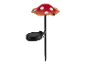 Lampe solaire en forme de champignon rouge à pois blancs.