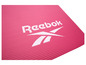 Un tapis de yoga rose avec le logo Reebok.