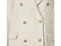 Une veste blanche en tweed avec des boutons dorés.