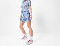 Haut et short cycliste Lidl, baskets blanches.