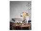 Lampe LED en forme de champignon avec finition antique, sur une table en bois.