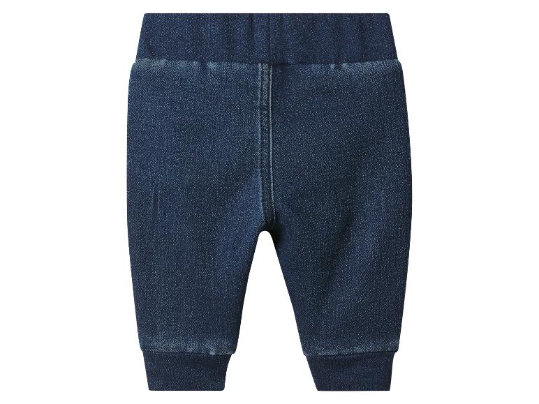 Pantalon de bébé en jean bleu foncé avec taille élastique et revers.