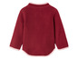 Un sweat-shirt en polaire bordeaux avec des détails roses.